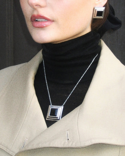 Black Panther necklace worn – modern silver pendant with black onyx, inspired by strength and quiet power.