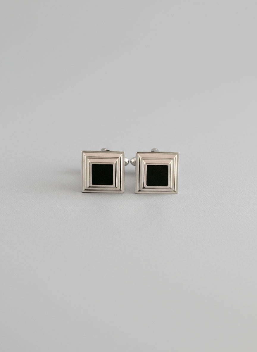 Two square frames with black centers on a white background