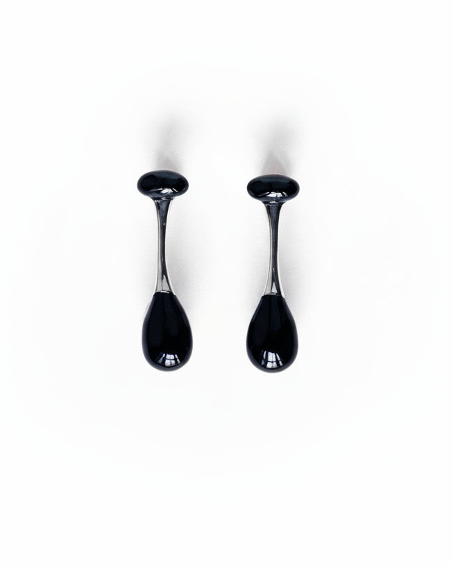 Cold Edges Umbra silver drop earrings with two black onyx stones, on a white background