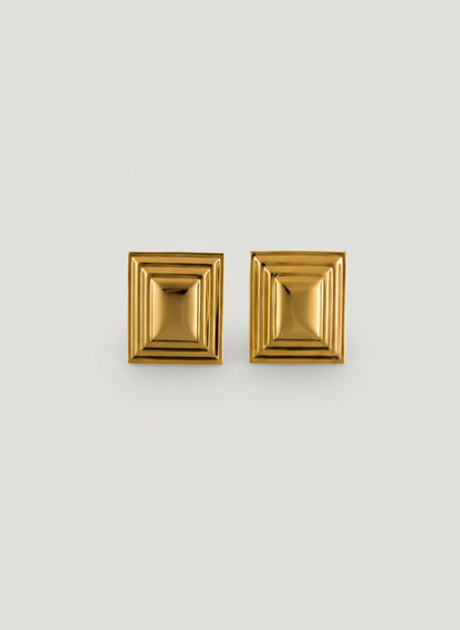 Pair of gold rectangle earrings on a white background