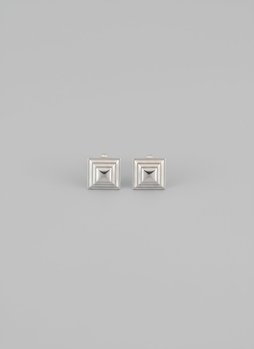 Small delicate statement earrings perfect for a Scandinavian look with a twist.