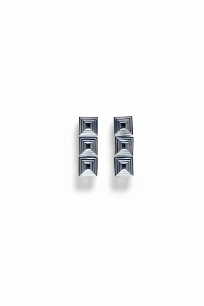 Cold Edges Siente Stack silver earrings with three stacked square forms, on a white background