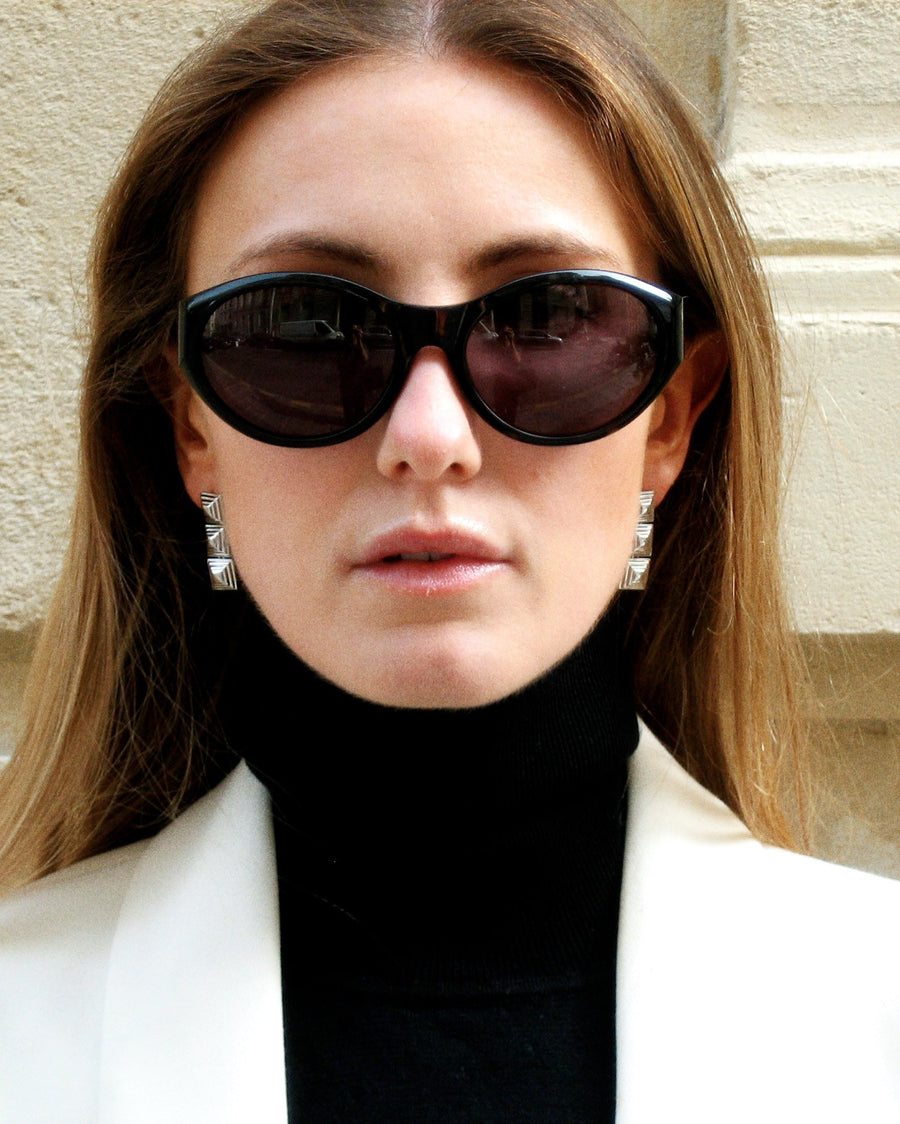 Model wearing Cold Edges Siente Stack stacked square drop earrings